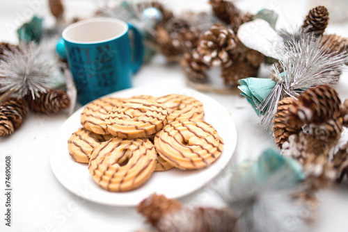 chocolate and caramel cookies with christmas decorations photo