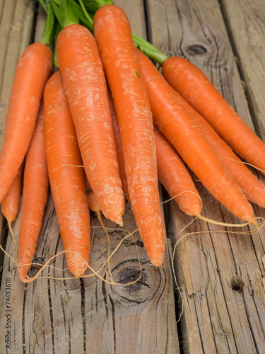 carrrots against aged wooden boards