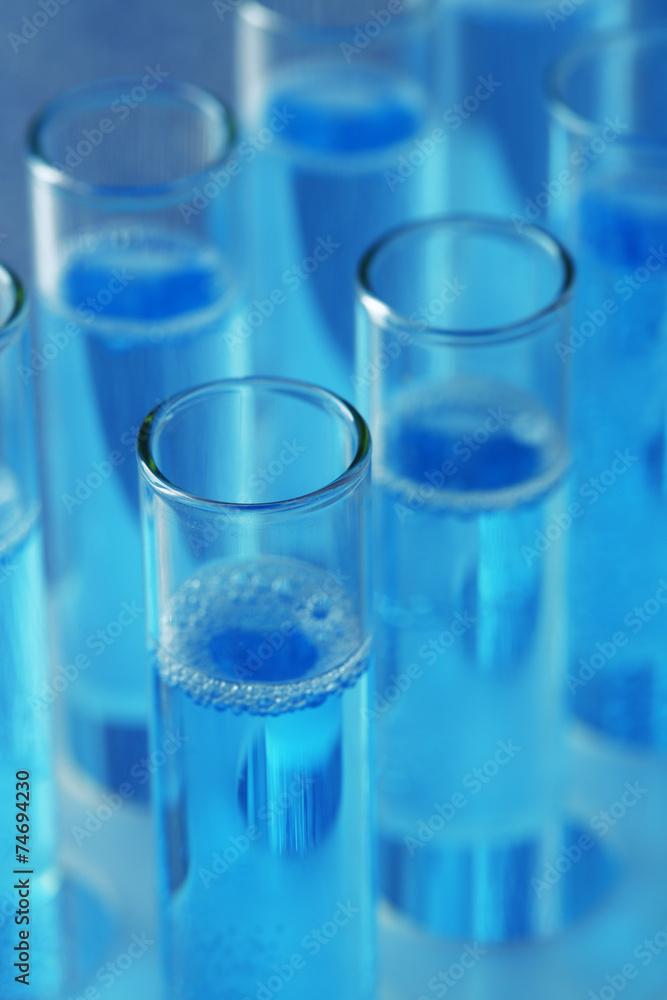 Test-tubes with liquid on color background Test-tubes with liquid on color background