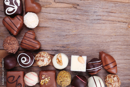 Group of sweets on wooden textured background