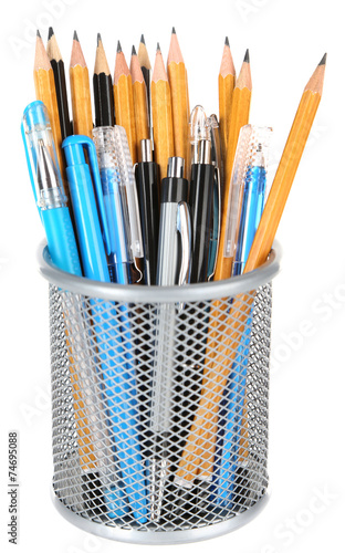 Group of pens and wooden pencils in metal vase isolated