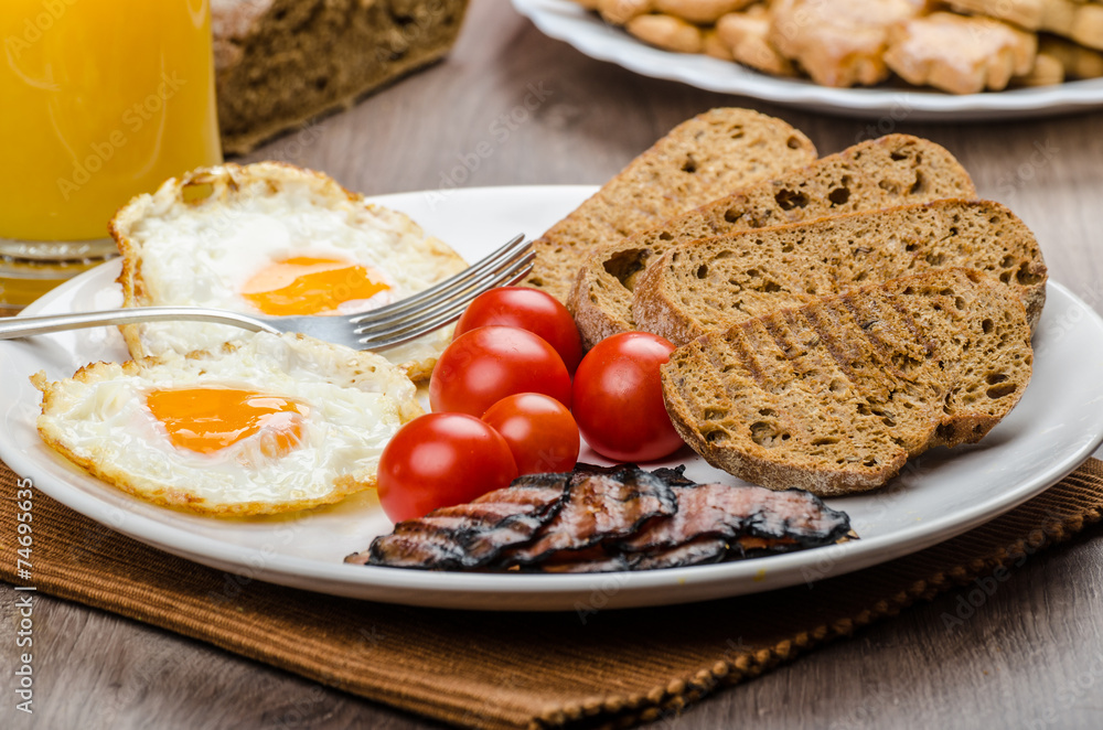 Breakfast- bacon, sausage, bread and eggs Breakfast- bacon, sausage, bread and eggs