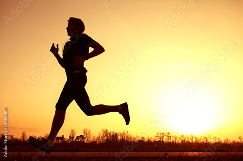 Silhouette runner in sunset rise