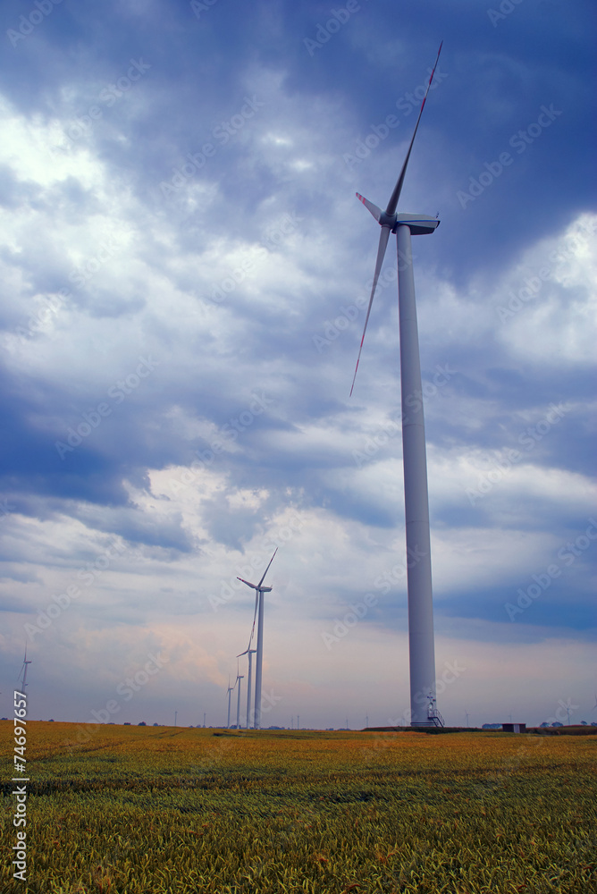 wind farms on meadow in Poland.