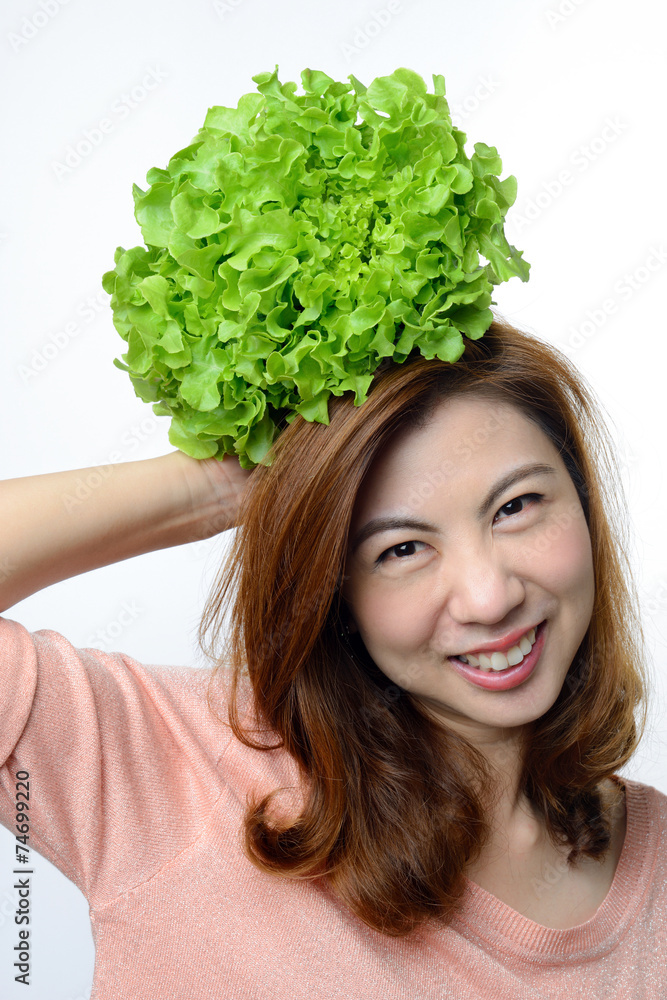 woman hold hydroponics green oak vegetable on her head woman hold hydroponics green oak vegetable on her head