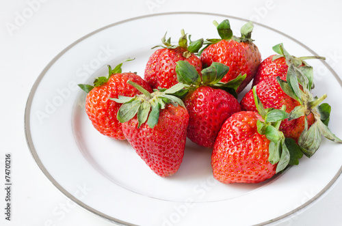 Ripe strawberries in a plate