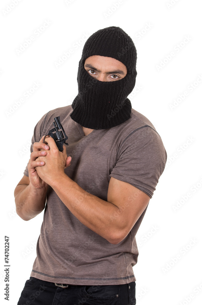 male thief wearing mask and holding gun isolated male thief wearing mask and holding gun isolated