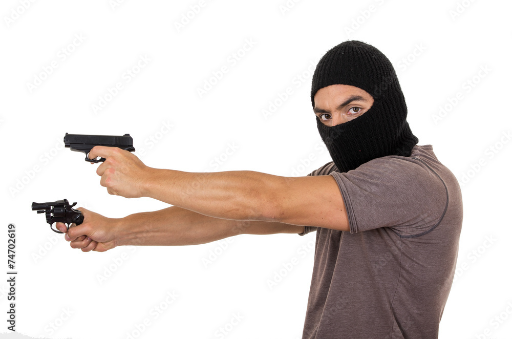 male thief wearing mask and holding guns isolated male thief wearing mask and holding guns isolated