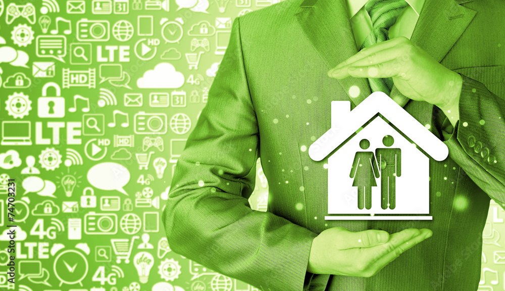 businessman protecting family in home with hands businessman protecting family in home with hands