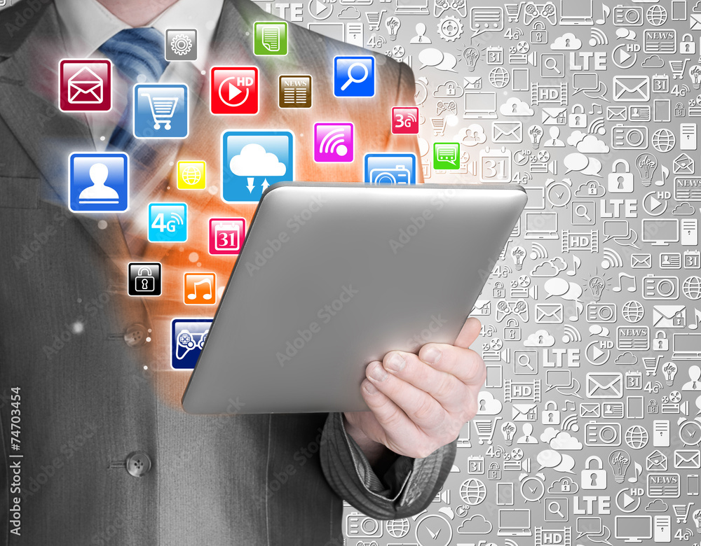 Business man use tablet pc with colorful application icons Business man use tablet pc with colorful application icons