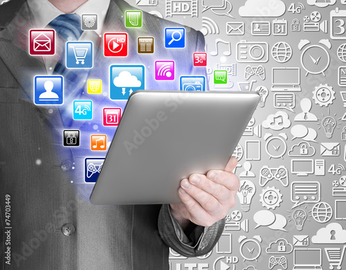 Business man use tablet pc with colorful application icons