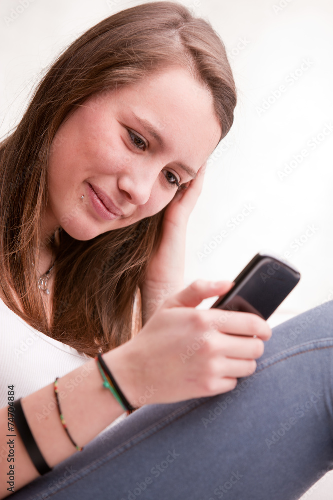 young girl focused on texting with mobile young girl focused on texting with mobile