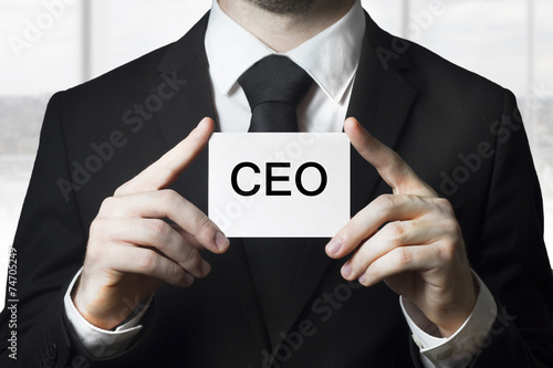 businessman holding sign ceo