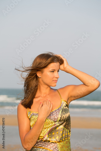 Beauty woman against seashore