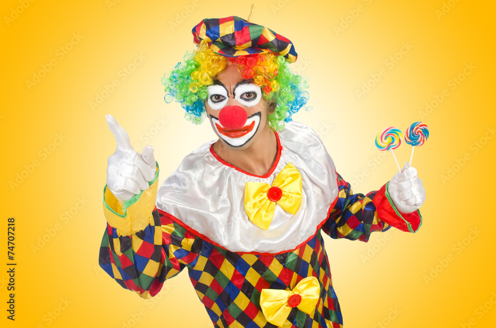 Clown with lollipops isolated on white Clown with lollipops isolated on white