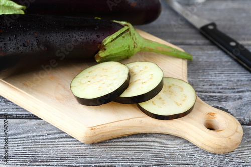 Fresh eggplant on a cutting board