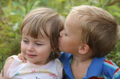boy kisses girl