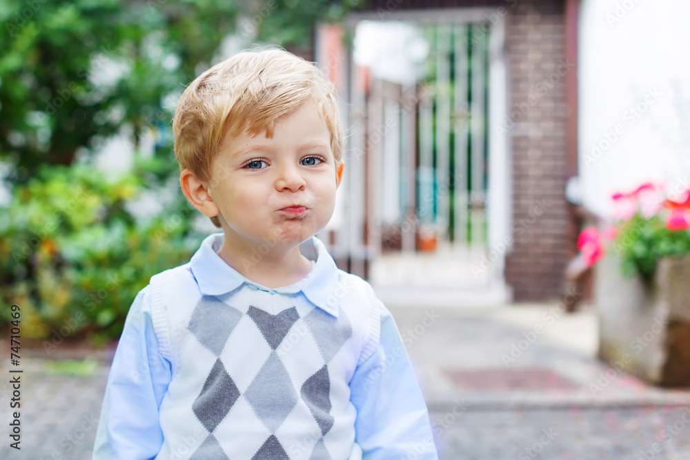 Funny happy and smiling kid boy on way to nursery Funny happy and smiling kid boy on way to nursery