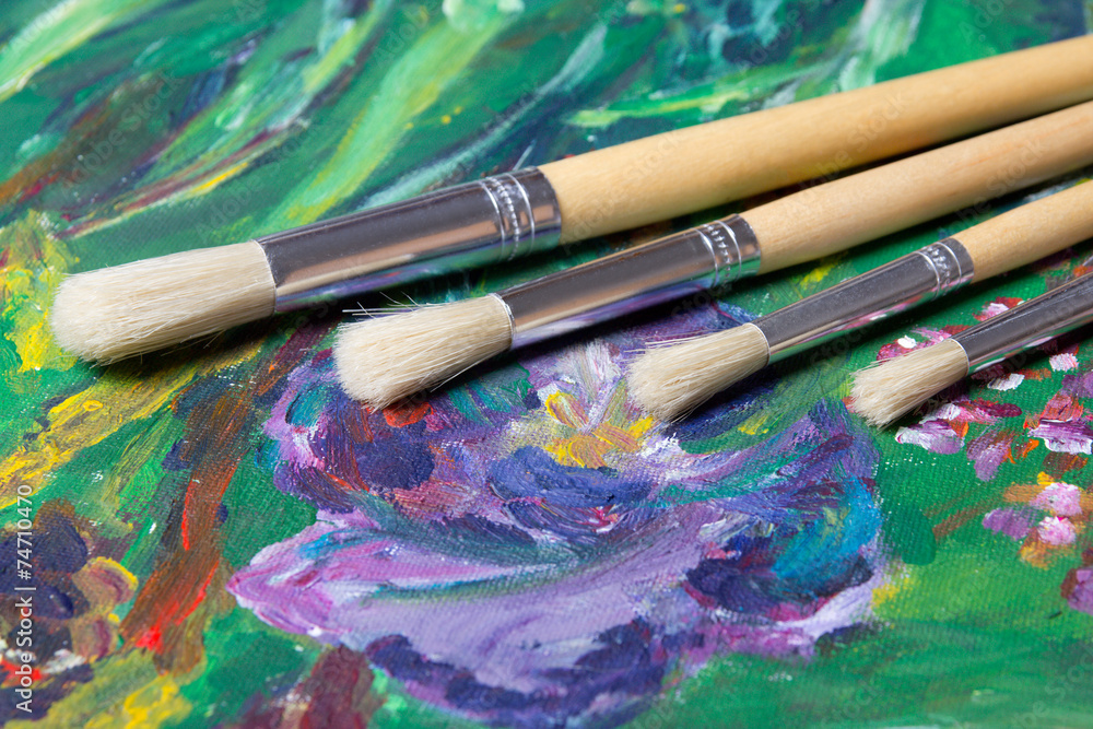 Obraz premium close up of acrylic paint and paint brushes set
