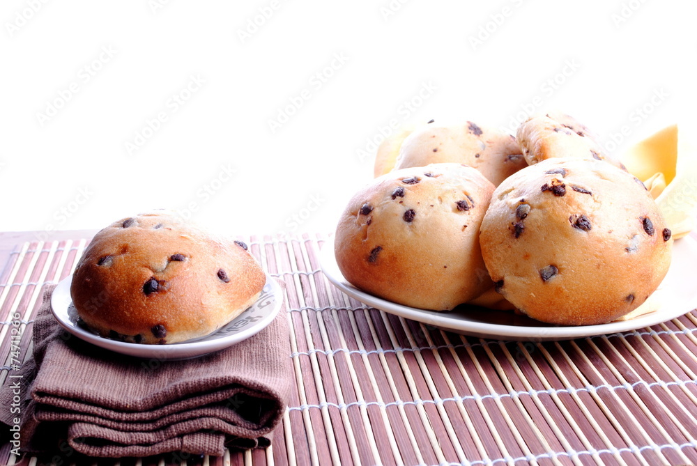 sweet bread with chocolate drops over bamboo placemat