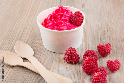 Frozen creamy ice yoghurt  with whole raspberries