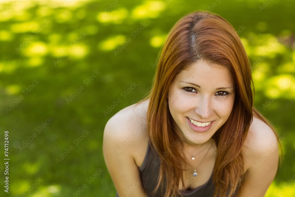 Portrait of a pretty redhead smiling Portrait of a pretty redhead smiling