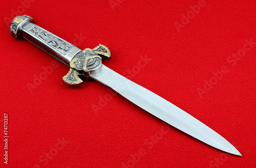 dagger on a red background