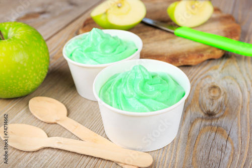 Frozen creamy ice yoghurt  with fresh green apples photo