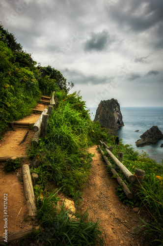 Shakotan coast with stairs leading up to the sea under overcast.