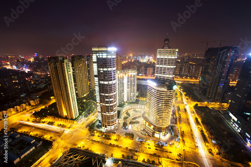 modern cityscape and traffics during night