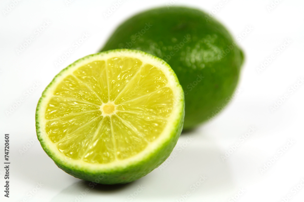 Fresh limes on white background