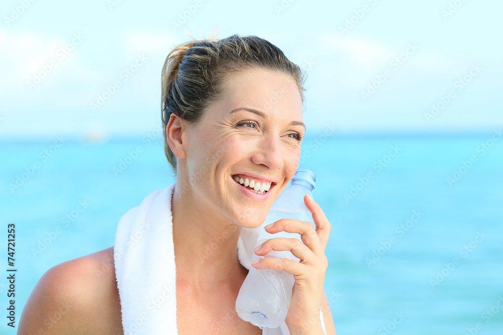 Portrait of fitness woman drinking water after working out Portrait of fitness woman drinking water after working out