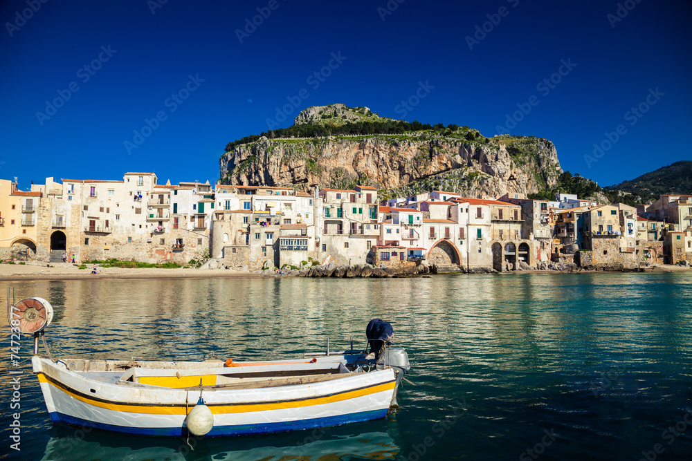 boat drifting in a harbor of Cefalu