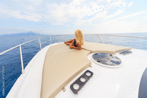 Young sexy woman enjoy on yacht at faraglioni island capri italy © Andrea