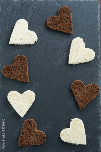 Wallpaper Mural dark background with toasted rye and white bread in heart shape Torontodigital.ca