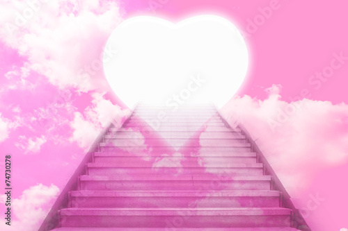 stairway going up to the hearts with pink sky background