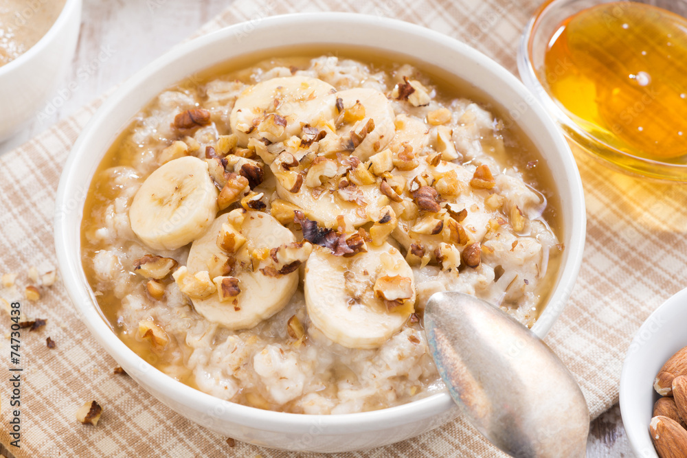 healthy breakfast - oatmeal with banana, honey and walnuts healthy breakfast - oatmeal with banana, honey and walnuts