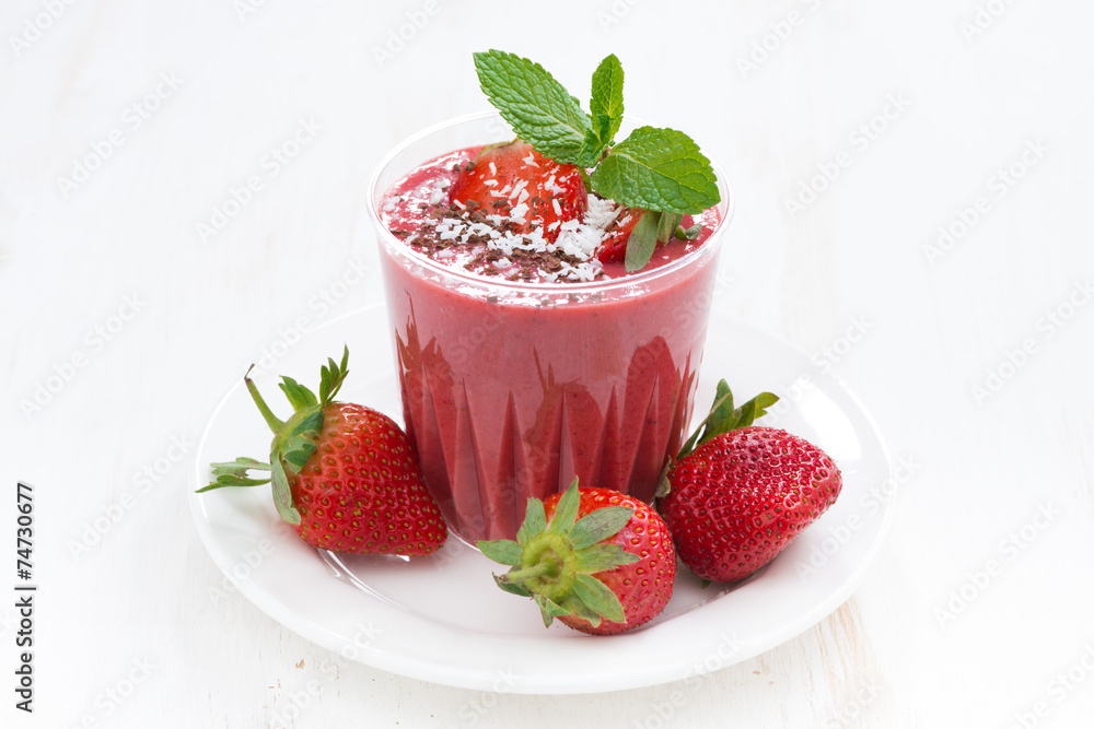 strawberry milkshake in a glass on white table strawberry milkshake in a glass on white table
