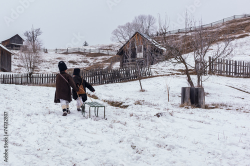 children playing  in the snow