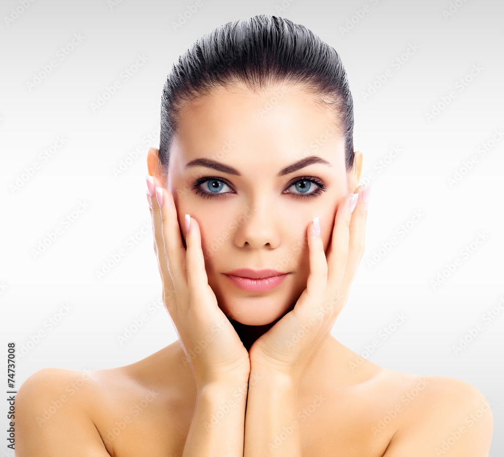 Pretty woman against a grey background with copyspace Pretty woman against a grey background with copyspace