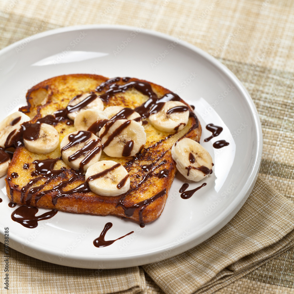 French Toast with Bananas and Chocolate sauce. Selective focus French Toast with Bananas and Chocolate sauce. Selective focus