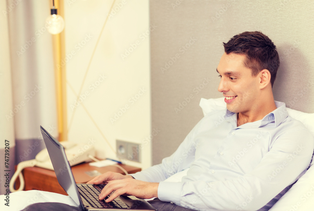 happy businesswoman with laptop in hotel room happy businesswoman with laptop in hotel room