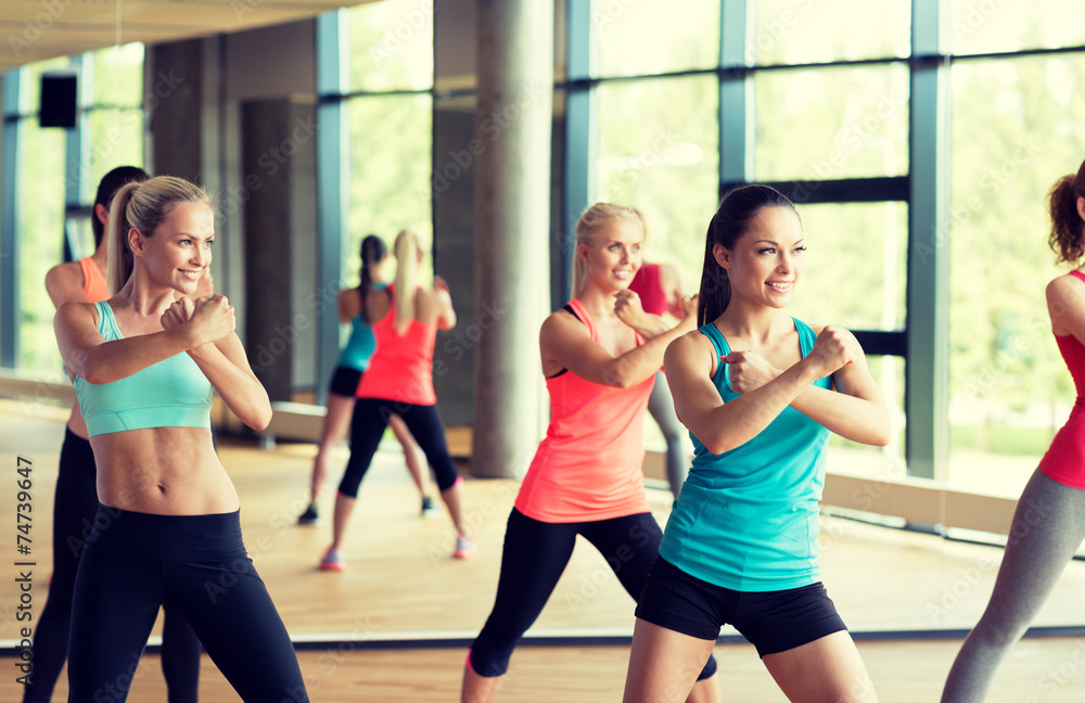 group of women working out in gym group of women working out in gym