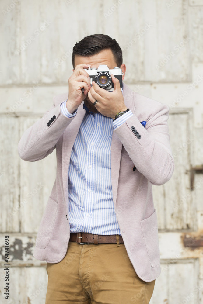 Men taking photo with film camera Men taking photo with film camera