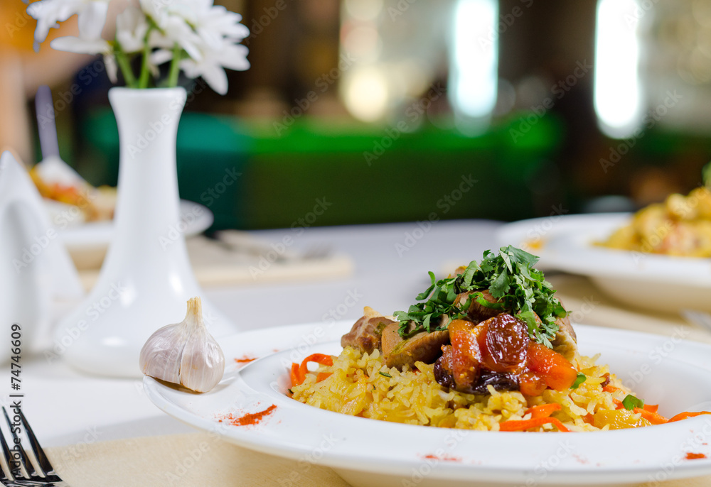 Roast meat on a bed on savory rice Roast meat on a bed on savory rice