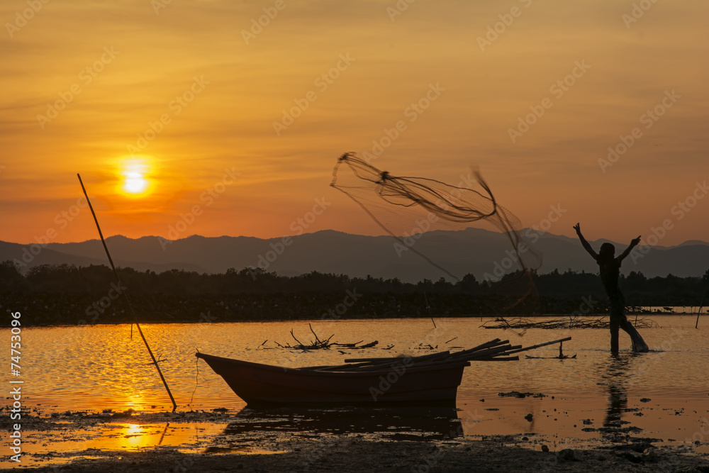 silhouette fishing boat and sunset in Thailand