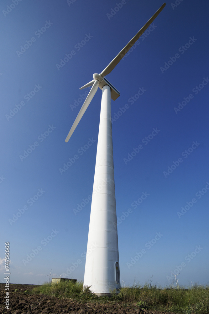 Photo of Wind power installation in sunny day Photo of Wind power installation in sunny day