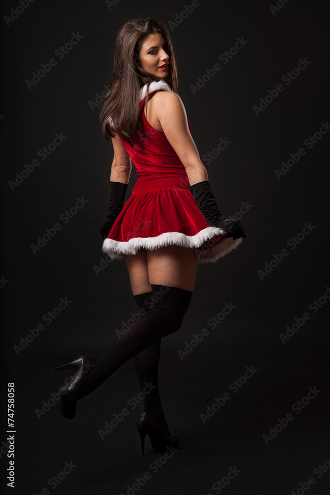 Beautiful brunette woman with retro glasses dressed as Santa Beautiful brunette woman with retro glasses dressed as Santa