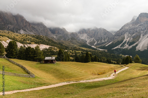 walker on track in Dolomites