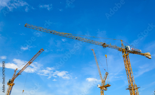 construction cranes with blue sky